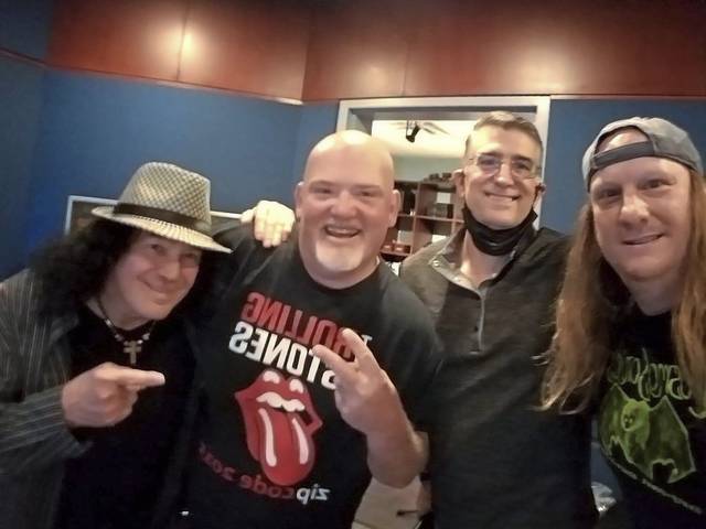 (from left) Hermie Granati, Anthony “Rocky” Lamonde, Bob McCutcheon and Eric Rodger pose for a photo at The Vault Recording Studio on Neville Island.